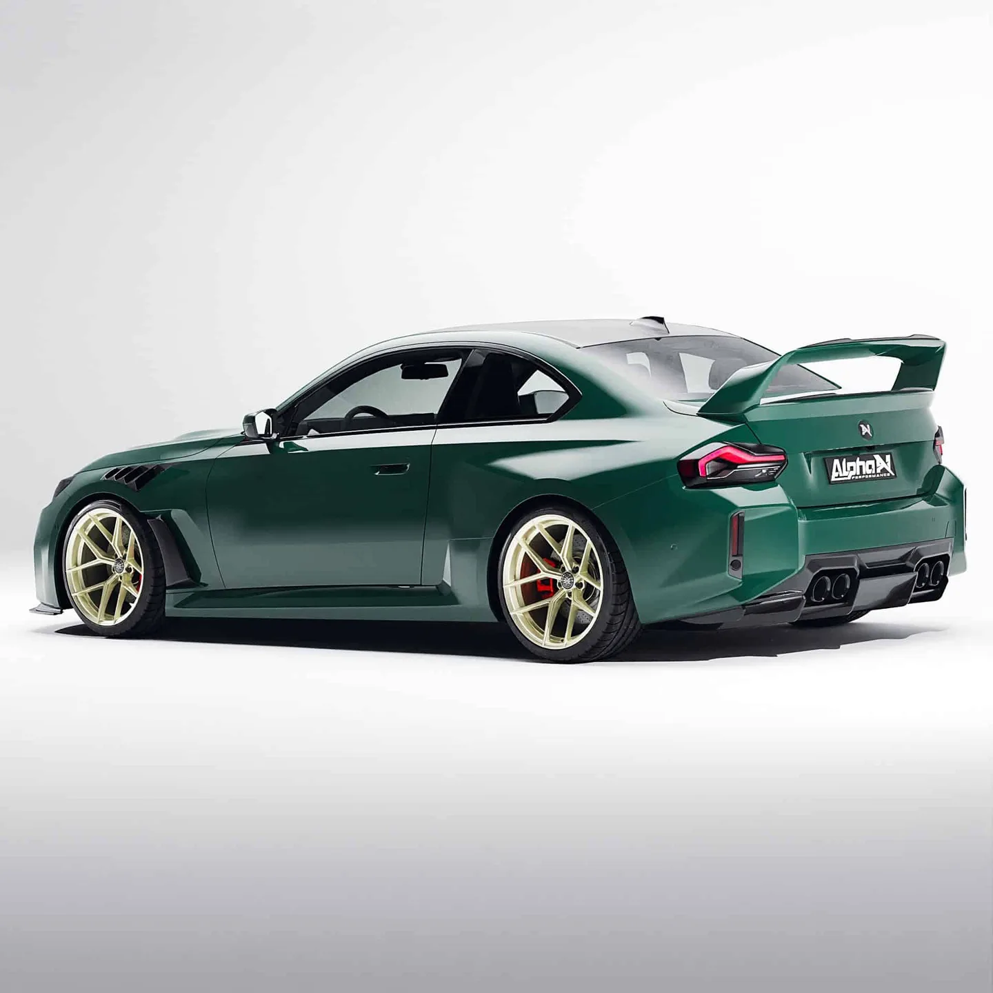 Groene BMW M2 met carbon onderdelen en achtervleugel van Alpha-N